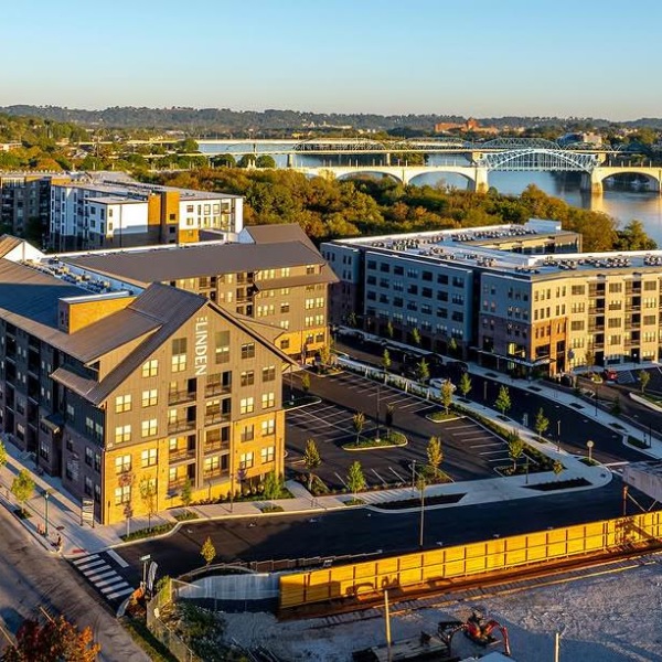 Your new home is waiting aerial view of a community with a bridge over water in the background