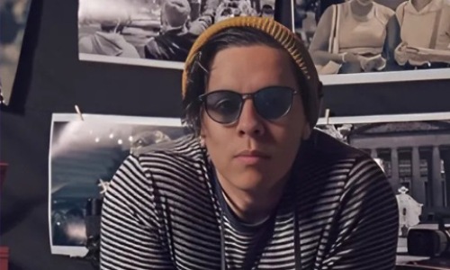 a person sitting posing for a picture