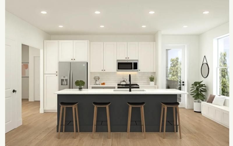 a kitchen with white cabinets